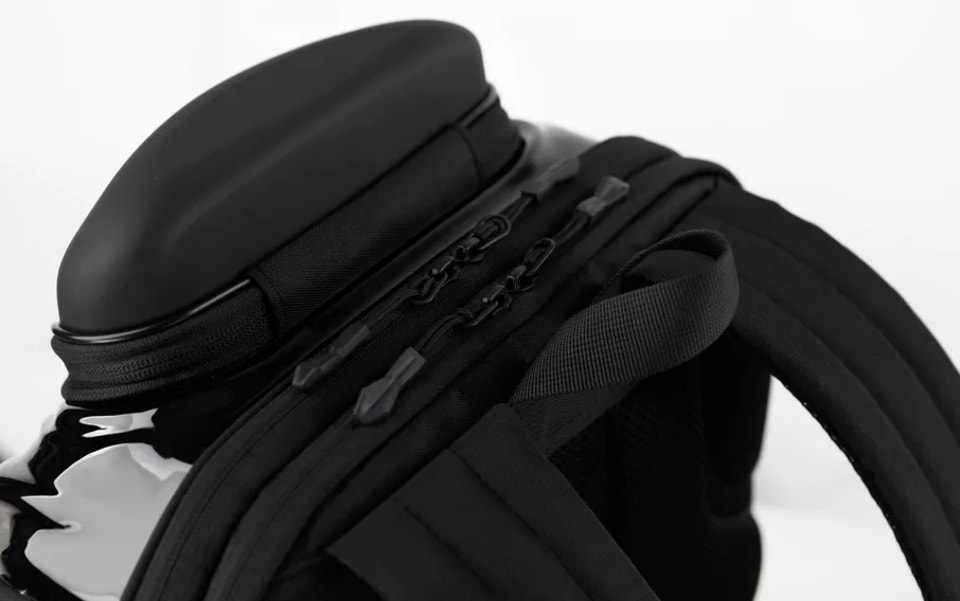 Hard-shell backpack with shoulder straps