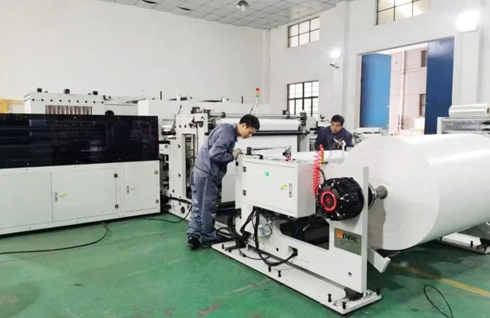 A GPPE engineer working at a converting line on the test floor
