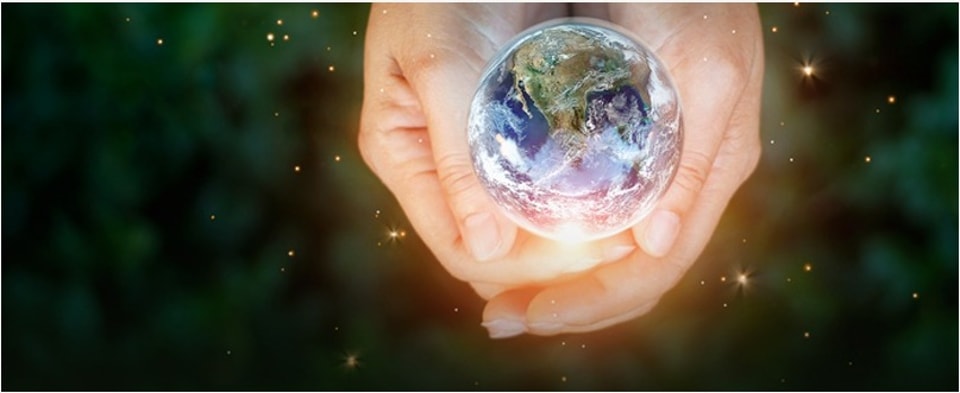 Hands holding the Earth, symbolizing corporate social responsibility