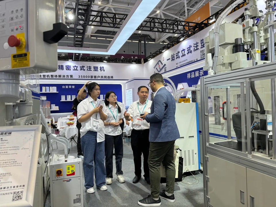 Our team walking visitors through the machines