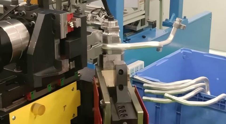 How can we reduce downtime by properly maintaining the sensors on a pipe bending machine?